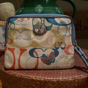 Coach Optic Signature Butterfly zip-around wallet/wristlet “C" logo pattern.